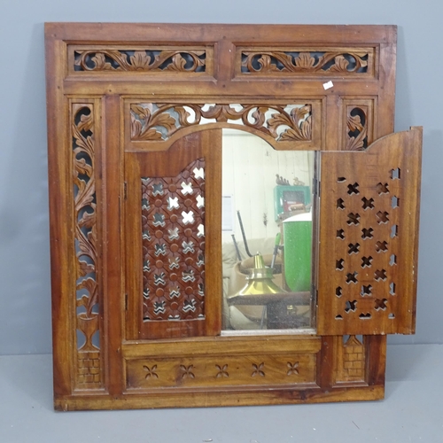 2228 - A Balinese hardwood shuttered mirror. Overall 80x90cm, mirrored panel 45x49cm.