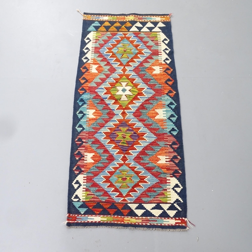 2284 - A Chobi Kilim runner. 145x62cm.