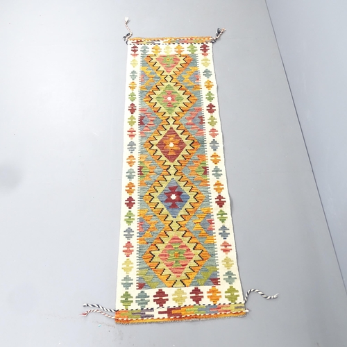 2287 - A Chobi Kilim runner. 210x64cm.