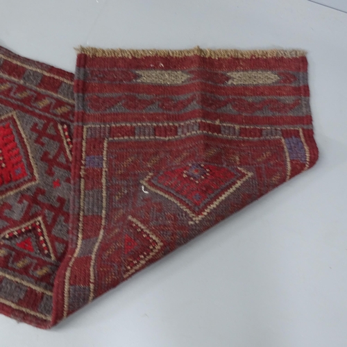 2288 - A red-ground Meshwani runner. 248x53cm