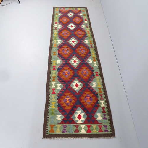 2290 - A Maimana Kilim runner. 296x86cm.