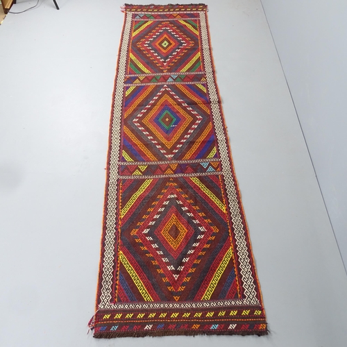 2291 - A Suzni Kilim runner. 310x78cm.