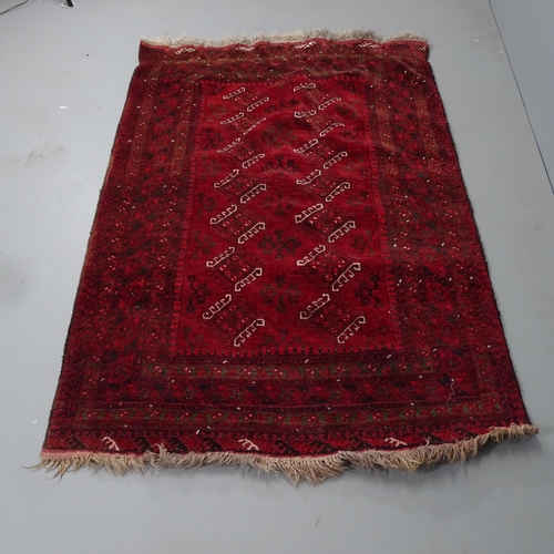 2298 - A red-ground Turkaman rug. 204x130cm.