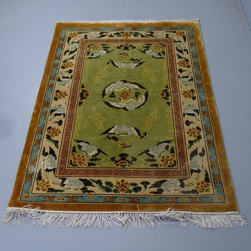 2302 - A Chinese silk rug with bird decoration. 185x122cm