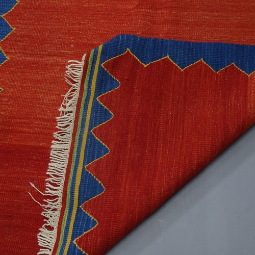 2308 - A red-ground Iranian Kilim rug. 148x108cm.