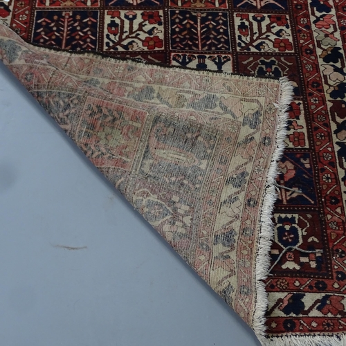 2313 - A hand knotted Bakhtiar garden carpet, approximately 80 years old. 195x148cm