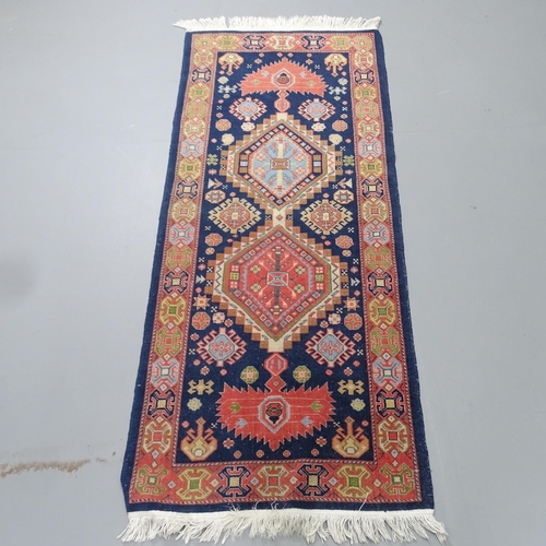 2331 - A hand-knotted Caucasian runner. 147x63cm