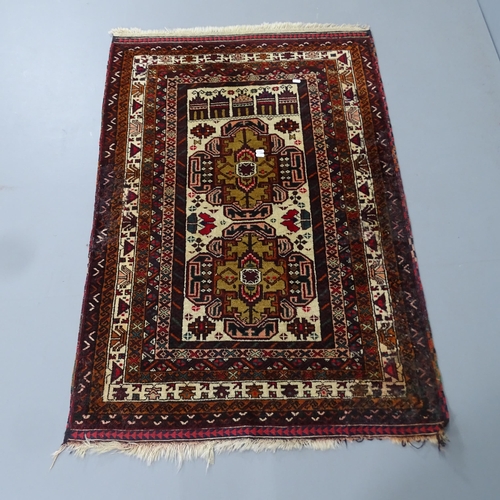 2332 - A red-ground Persian design rug. 133x92cm.