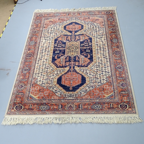 2333 - A cream-ground Keshan carpet. 200x140cm.