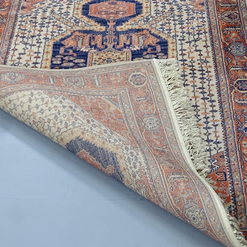 2333 - A cream-ground Keshan carpet. 200x140cm.