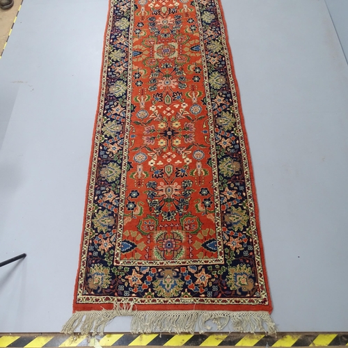 2335 - A Persian Sarouk runner. 348x90cm