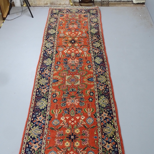 2335 - A Persian Sarouk runner. 348x90cm