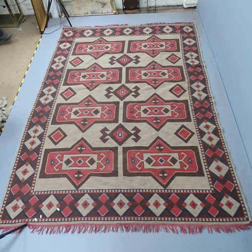 2336 - A cream-ground Kilim carpet. 295x205cm.