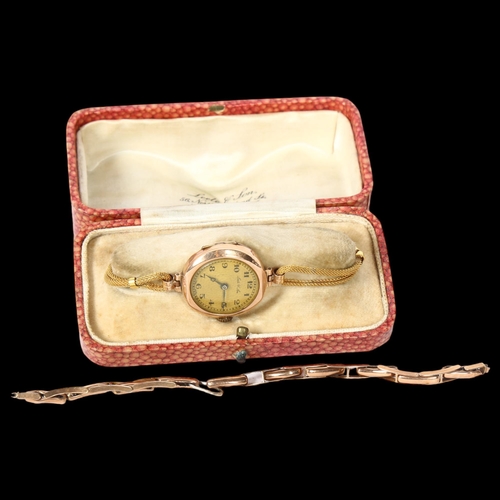 1221 - LEETS of JON - a lady's 9ct gold cased wristwatch, with brass crown and plated strap, and a separate... 