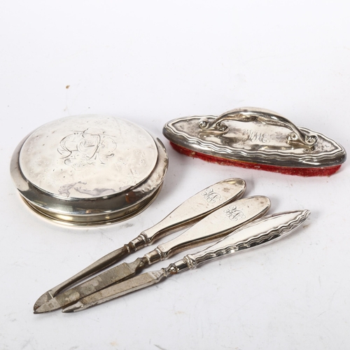 1231 - A silver-topped dressing table jar, silvered-handled manicure items and nail buffer