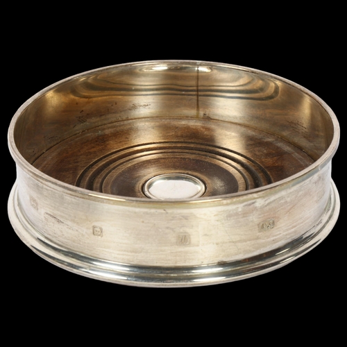 1243 - An Elizabeth II silver and turned wood wine coaster, diameter 13cm