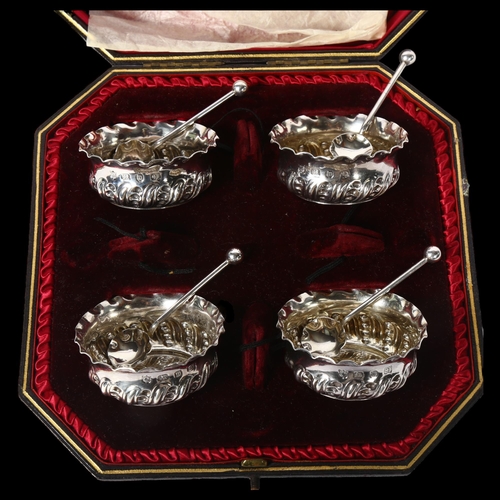 1249 - A Victorian silver salt set, comprising 4 salts with embossed decoration and 4 matching teaspoons, i... 