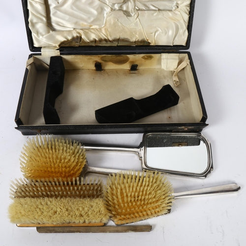 1114 - A George VI engine turned silver-backed dressing table set, comprising 4 brushes and hand mirror, an... 