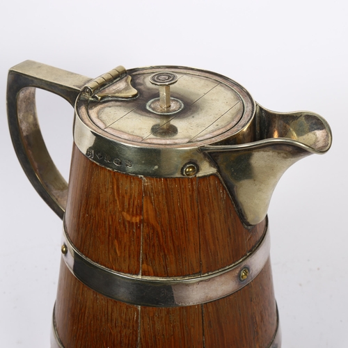 1117 - An Edwardian coopered oak water/ale jug with silver plated mounts, overall height 21cm