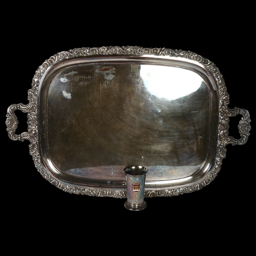 1125 - A large silver plate on copper 2-handled serving tray, with acanthus leaf and shell cast edge, on sc... 