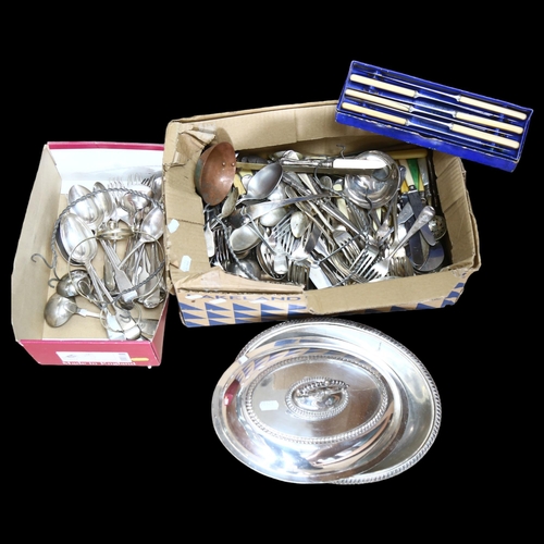 1143 - A large quantity of mixed plated cutlery, an oval tureen and cover (boxful)