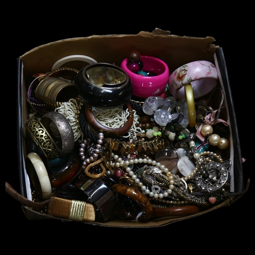 1153 - A large collection of modern costume bangles, necklaces etc