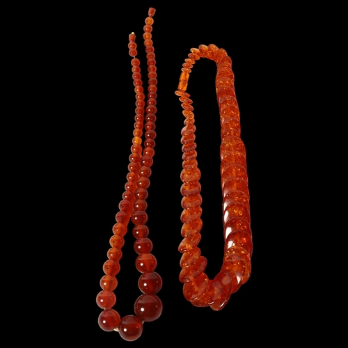 1176 - 2 phenolic amber necklaces, 1 oval disc design, length 59cm, and a bead design, length 71cm (the cat... 