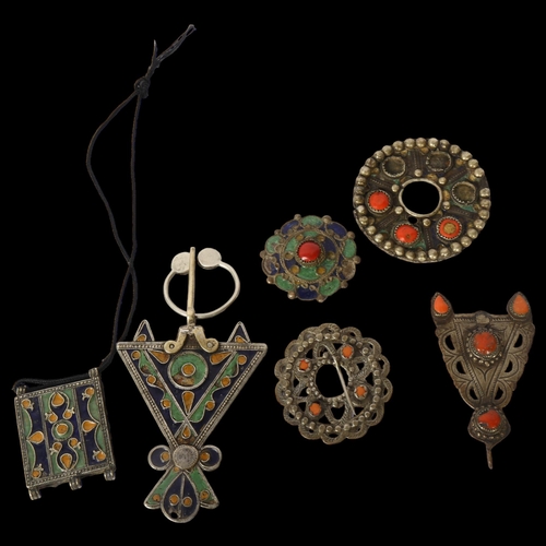 1185 - A collection of North African silver coral with blue enamel decorated mounts and pendants, a similar... 