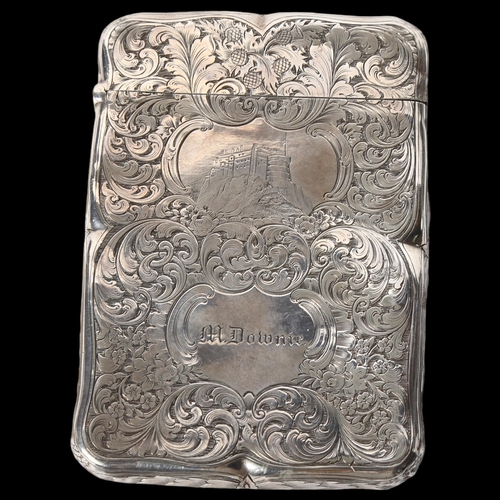 1186 - An ornate scrolled engraved silver plated card case, named to M Downie