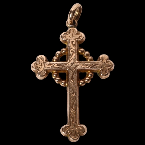 1193 - A 9ct gold engraved cross, maker's marks for Carrington & Company, 1.4g