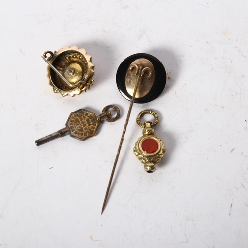 1208 - A gold-mounted fox design tie pin, gilt-metal stone set swivel fob, watch key, gilt-metal brooch