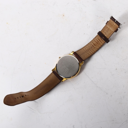 1218 - SECULUS - a gold plated quartz wristwatch with date aperture, leather strap, working order