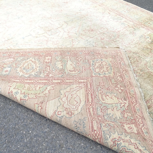 2343 - A cream ground Persian design carpet. 300 x 250cm.