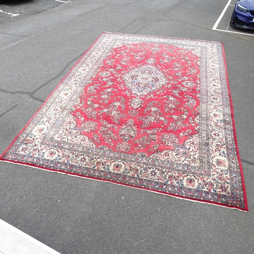 2345 - A large red ground Qashqai carpet. 523 x 346cm.