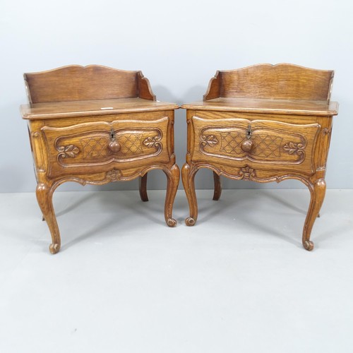 2150 - A pair of French oak bedside tables, with single drawer and raised on cabriole legs. 55x75x40cm