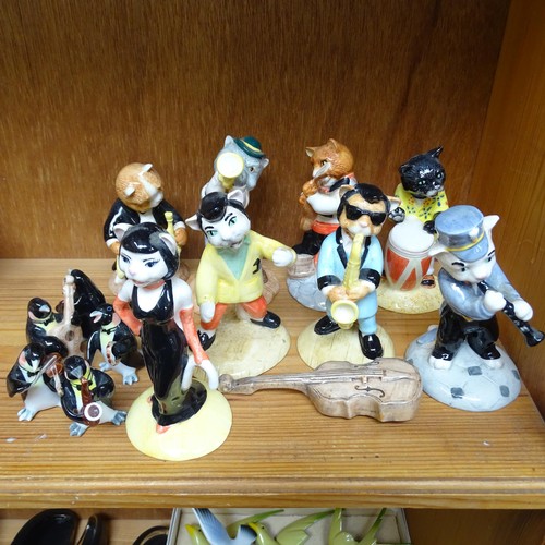 950 - A group of 8 Beswick cat musicians, and 6 miniature porcelain penguin musicians