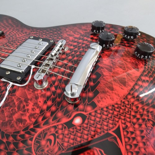 517 - JAXVILL - a 6-string electric guitar with snake decoration to the body, in the style of the Rockburn... 