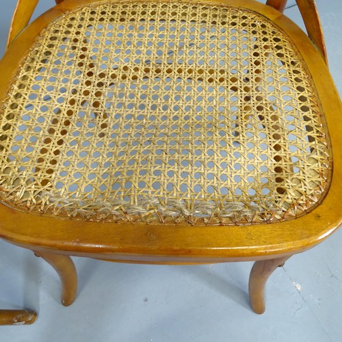 2746 - A pair of modern teak cane seated cross back dining chairs.