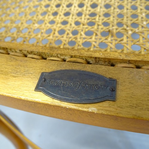 2746 - A pair of modern teak cane seated cross back dining chairs.