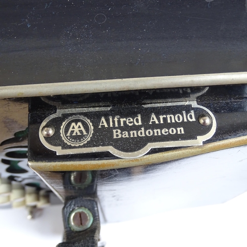 523 - ALFRED ARNOLD - a German bandoneon, bearing the maker's plaque of Alfred Arnold, enclosed within a h... 