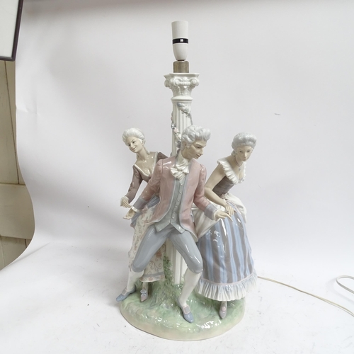 642 - A large Lladro porcelain table lamp supported by 3 figures in Period costume, on plinth (A/F), heigh... 