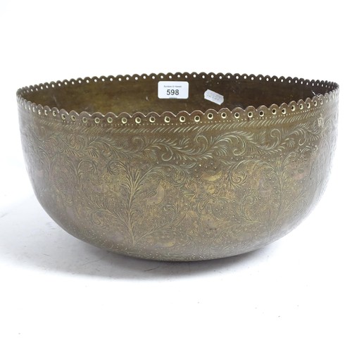 598 - A Tibetan engraved brass singing bowl with design of figures and foliage, and shaped pierced rim, 30... 