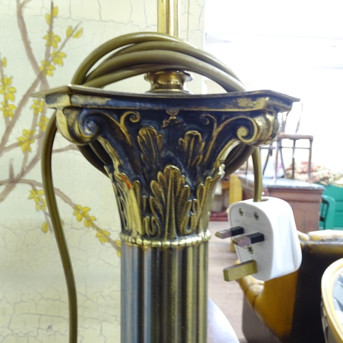 2022 - A 19th Century brass Corinthian column standard lamp on pedestal base. Height to bayonet 138cm.