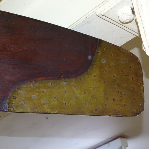 2205 - A large vintage aircraft propeller in mahogany with brass mounts, with inset clock. Length 250cm.