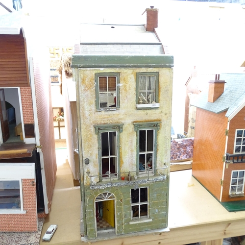 230 - A Vintage doll's house in the style of a townhouse, spread over 3 floors with fitted interior, inclu... 