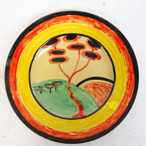 752 - A Clarice Cliff style plate, signed and dated 1932, 25.5cm, an Art pottery plate with painted mouse,... 