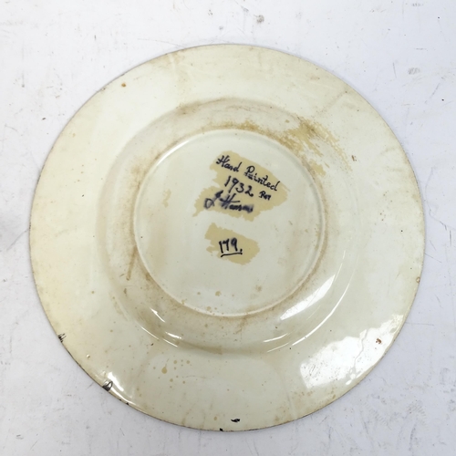 752 - A Clarice Cliff style plate, signed and dated 1932, 25.5cm, an Art pottery plate with painted mouse,... 