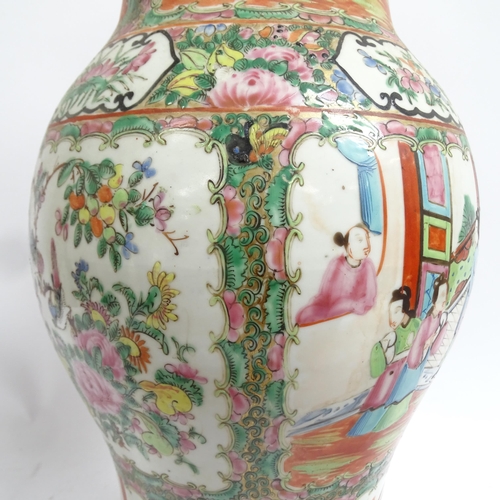 738 - A pair of large Chinese Canton famille rose ceramic baluster oil lamps, with hand painted and enamel... 