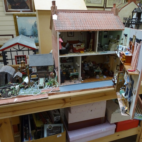 224 - A 1940s style doll's house and garden, 2 floors with fitted interior and associated garden scene, in... 