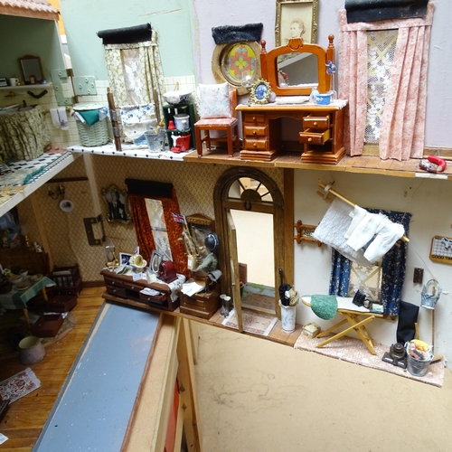 224 - A 1940s style doll's house and garden, 2 floors with fitted interior and associated garden scene, in... 